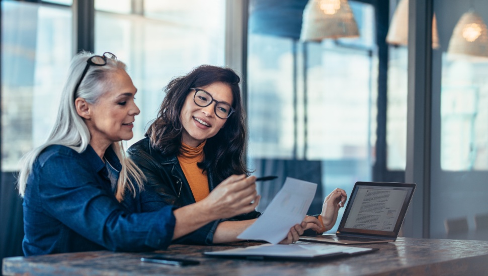 Two women in discussion in an office setting