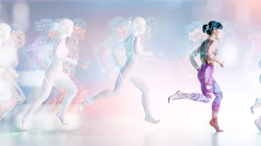 Digital art of a person running with holographic trails behind.