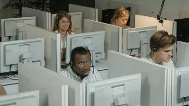 office workers sitting at their desks