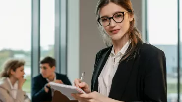 People in corporate wear in an office setting