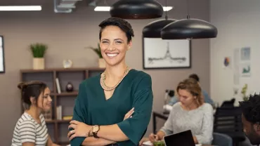 Female professional smiling in an office setting